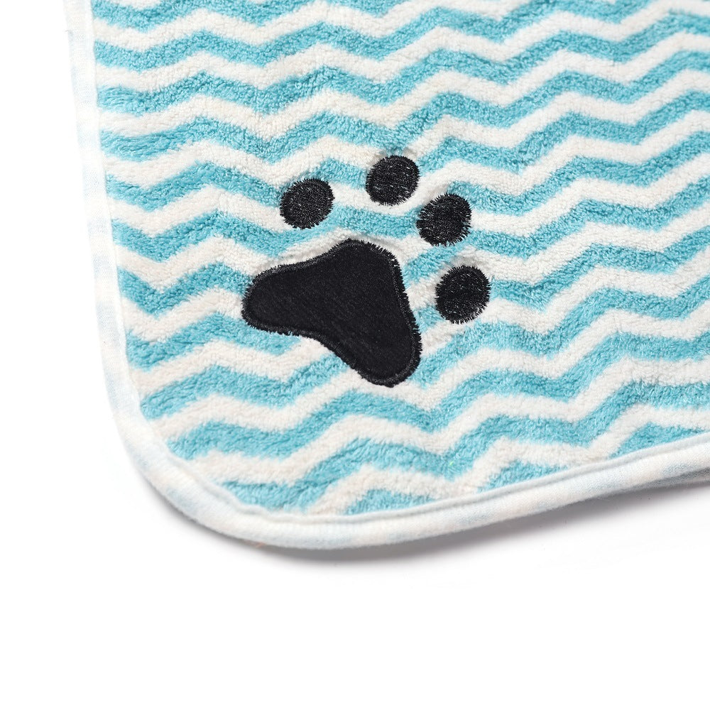 Towel with blue and white zigzag pattern and black paw print 