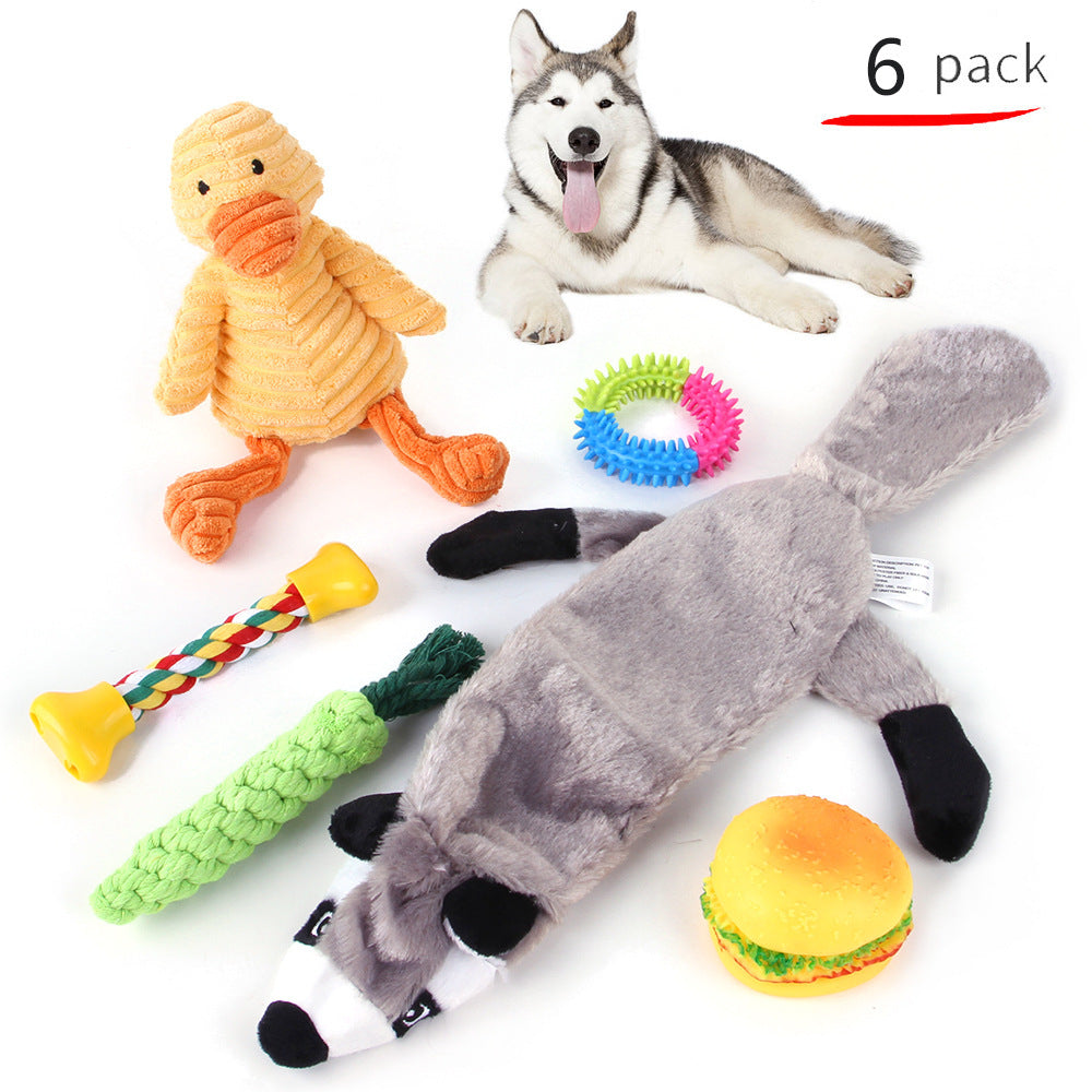 Set of dog toys including a duck, chew toy, and others with a husky dog on a white background.