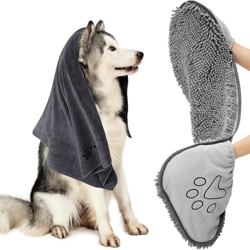 Dog wearing a towel with a paw-shaped cleaning tool next to it