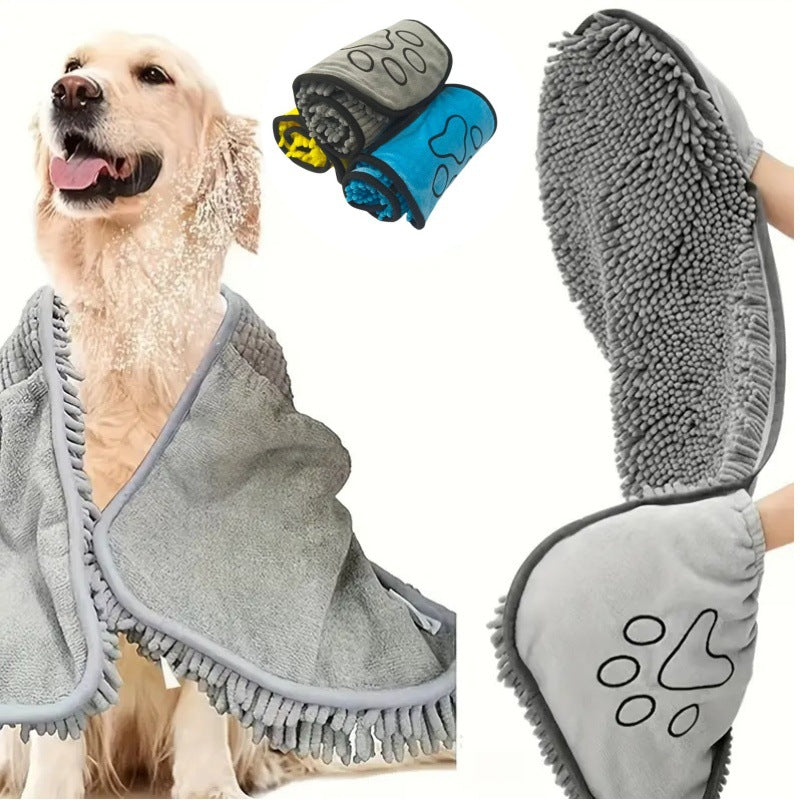 Dog wrapped in a gray towel with two grooming mitts on a white background